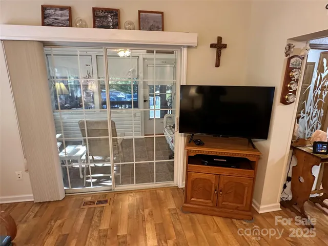 a room with furniture and a flat screen tv