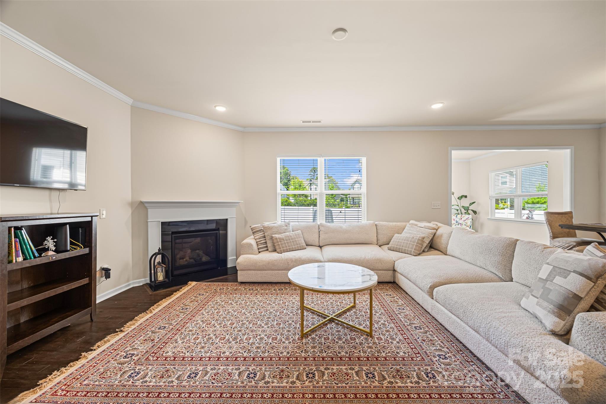 269 Keating Pl Drive Fort Mill, SC 29708 - Photo 13 of 48 a living room with furniture a rug a fireplace and a window
