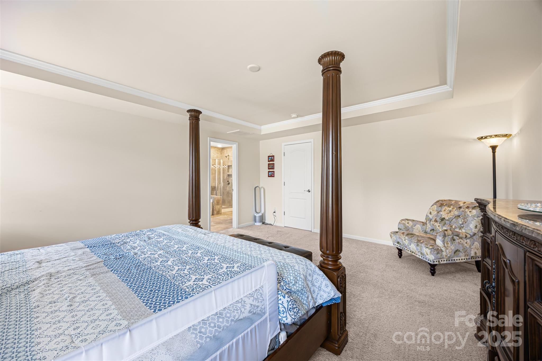 269 Keating Pl Drive Fort Mill, SC 29708 - Photo 32 of 48 a bedroom with a bed and a chandelier