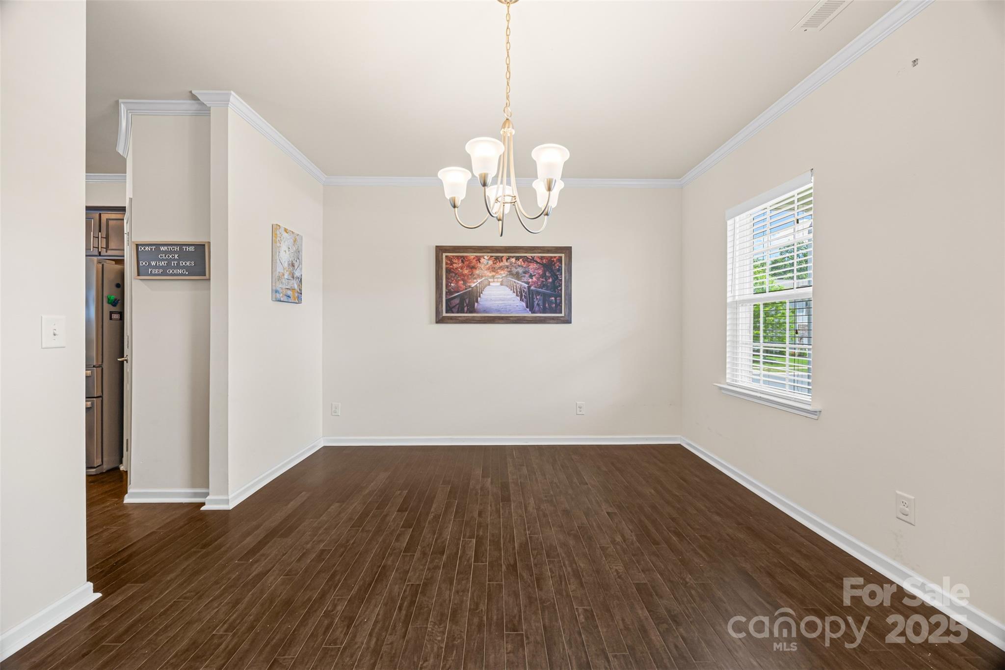 269 Keating Pl Drive Fort Mill, SC 29708 - Photo 6 of 48 a view of an empty room with wooden floor and a window