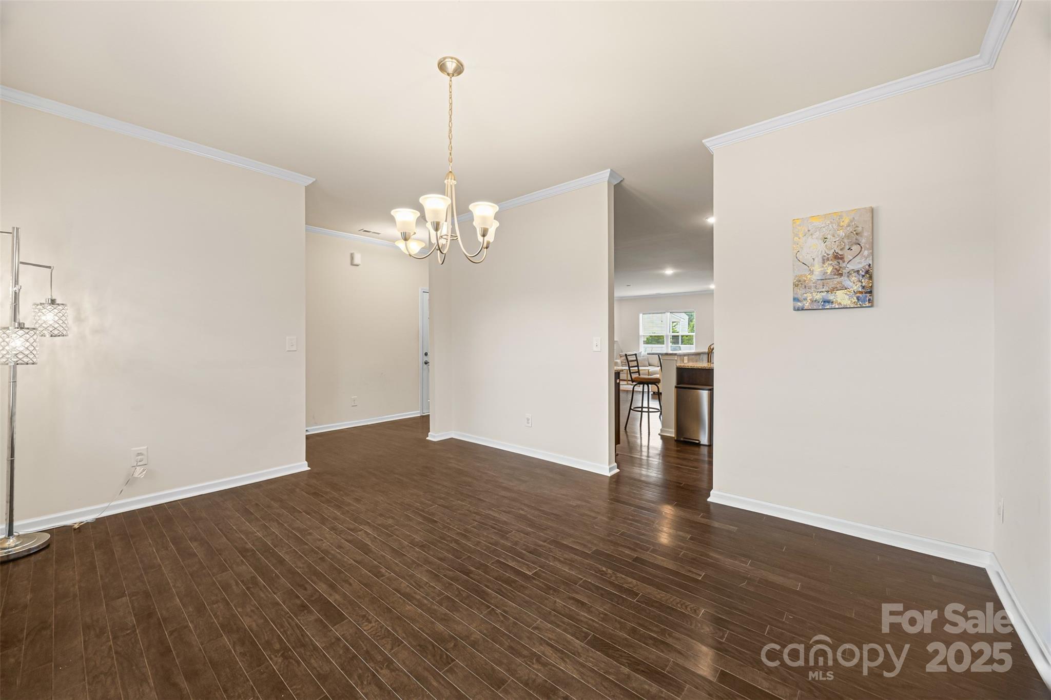 269 Keating Pl Drive Fort Mill, SC 29708 - Photo 9 of 48 a view of a kitchen with wooden floor and chandelier