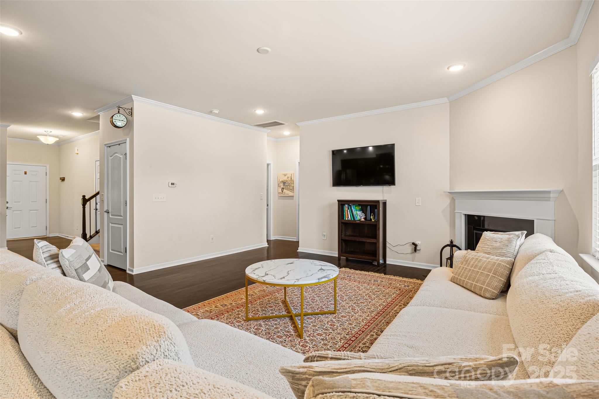 269 Keating Pl Drive Fort Mill, SC 29708 - Photo 10 of 48 a living room with furniture a fireplace and a flat screen tv