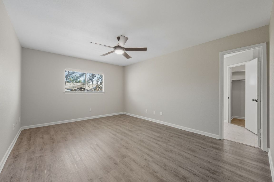 4615 Sidereal Drive Austin, TX 78727 - Photo 11 of 40 Spacious primary bedroom overlooking the backyard