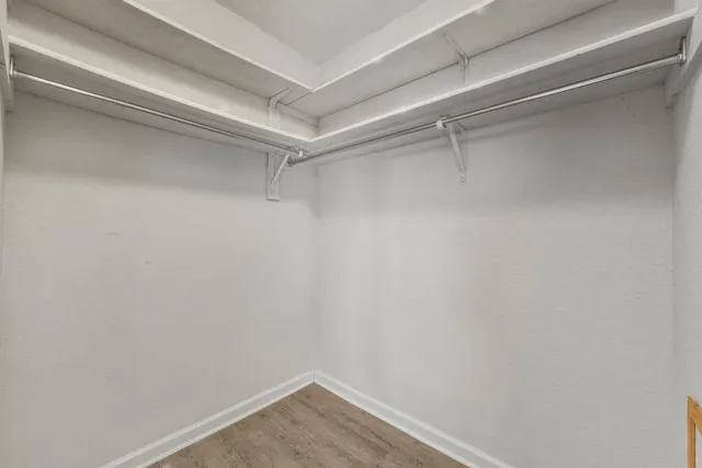 a view of an empty walk in closet