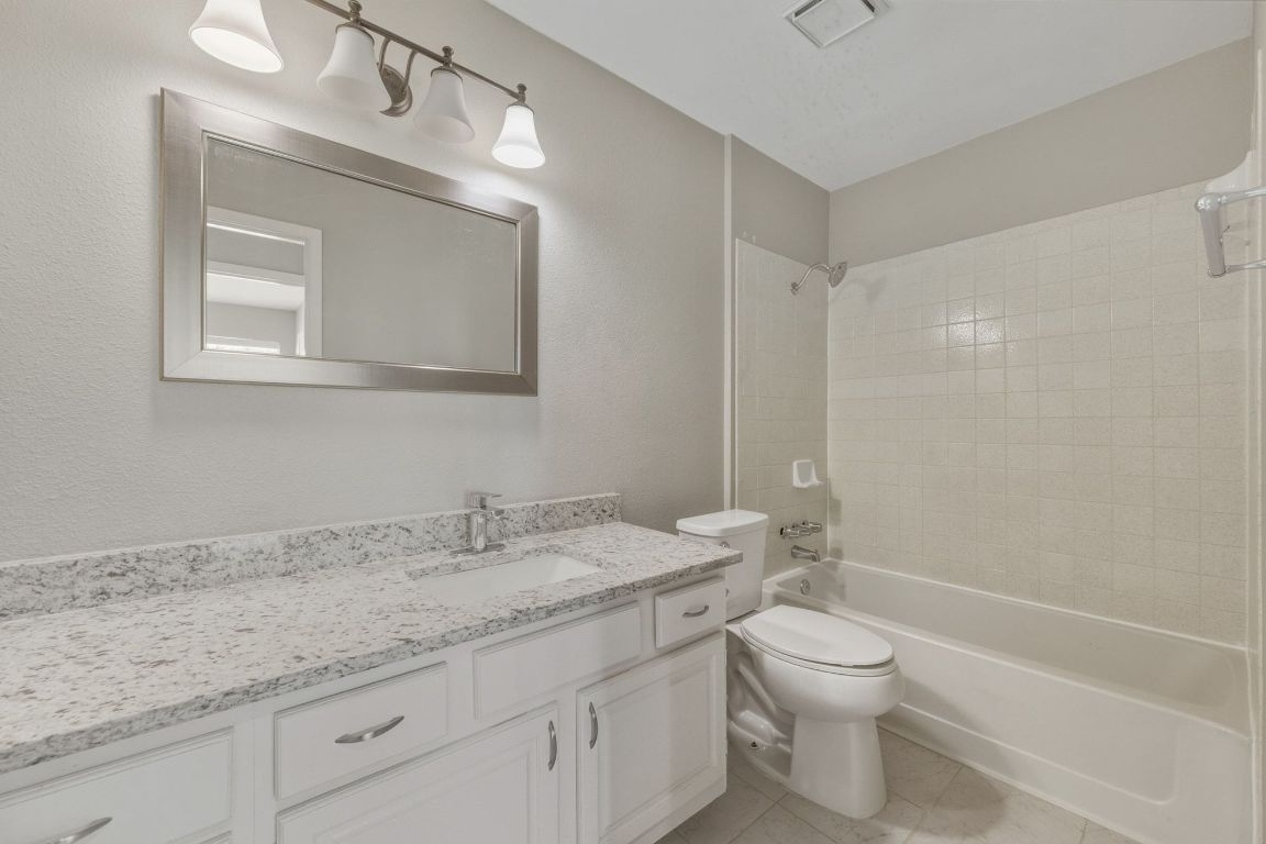 4615 Sidereal Drive Austin, TX 78727 - Photo 20 of 40 Full secondary bathroom with storage