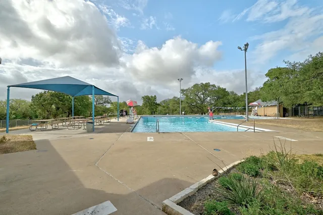 a childrens park with lots of swings and slides