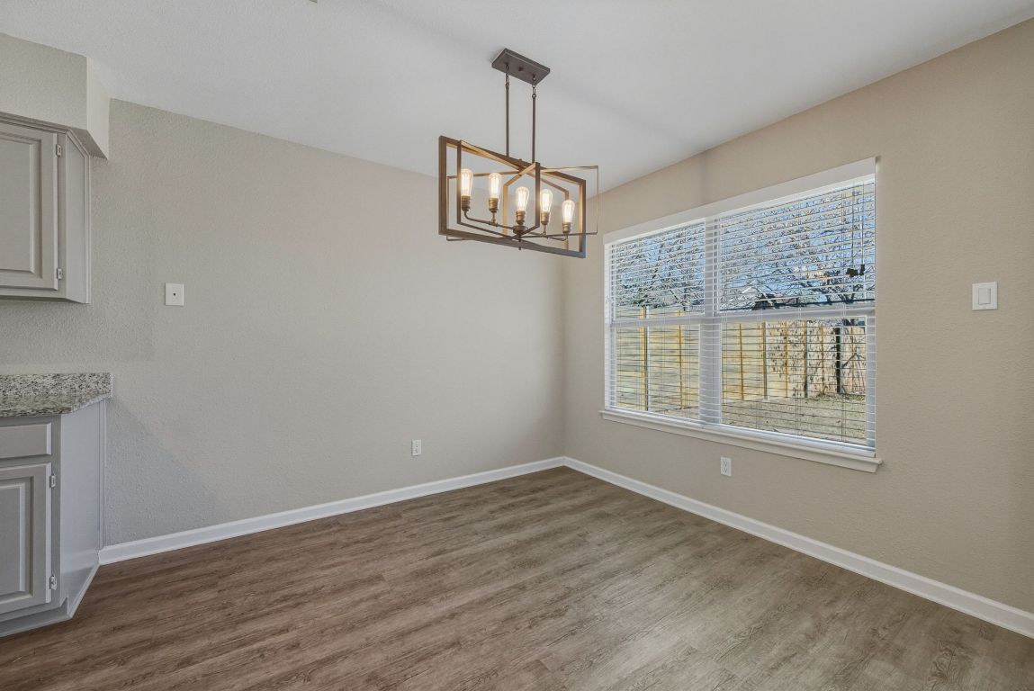 4615 Sidereal Drive Austin, TX 78727 - Photo 6 of 40 Dedicated dining space open to living and kitchen and overlooking the backyard