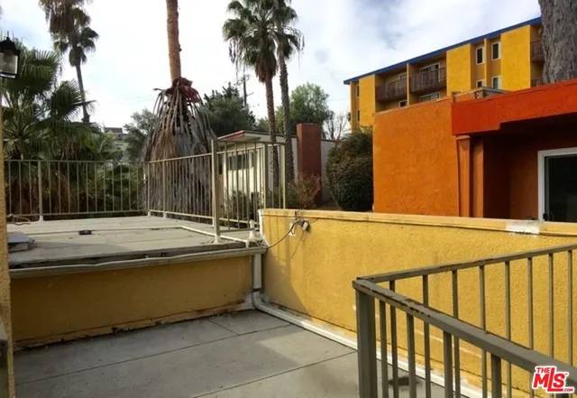 a view of balcony with a swimming pool