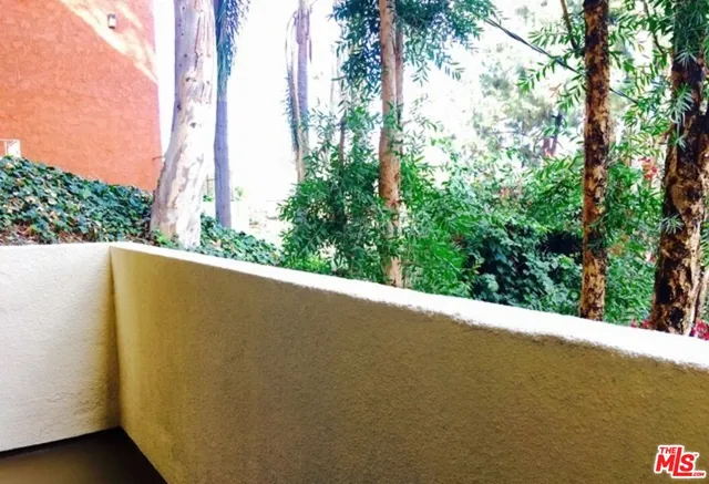 a view of a street from a balcony