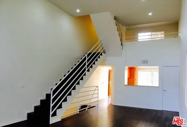 an entryway in a hall with a window