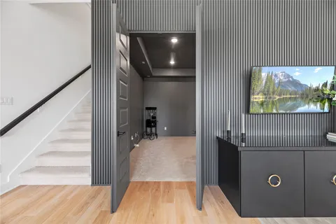 a view of a livingroom with furniture and staircase