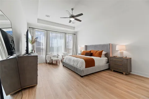 a bedroom with a bed and a couch