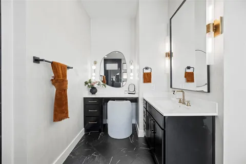 a bathroom with a sink and mirror