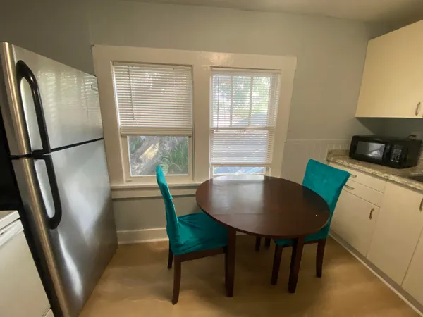 a view of a dining room with furniture window and outside view