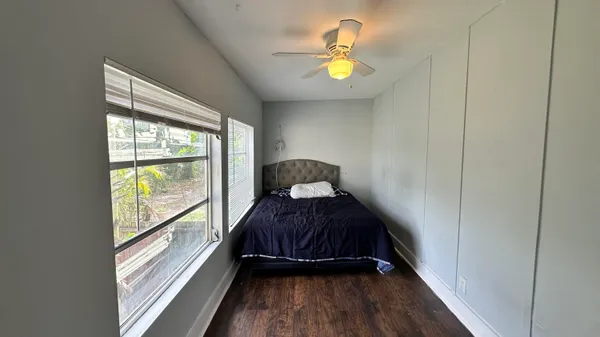 a bed room with a bed and a window