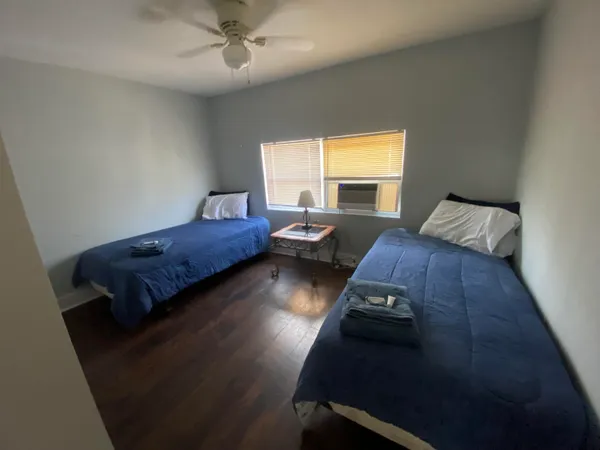 a bedroom with bed and window