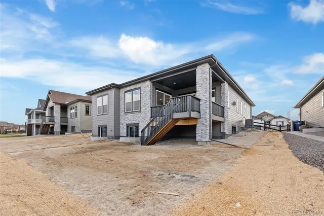 a view of a house with a snow in the background