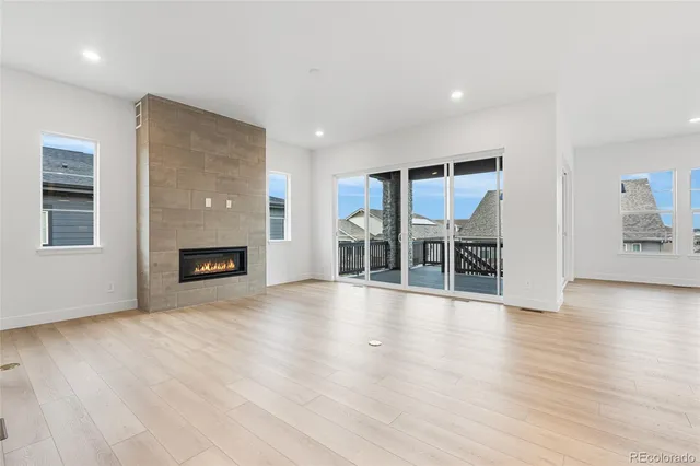 a view of a livingroom with furniture and a fireplace