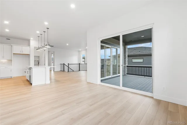 a view of kitchen with furniture and wooden floor