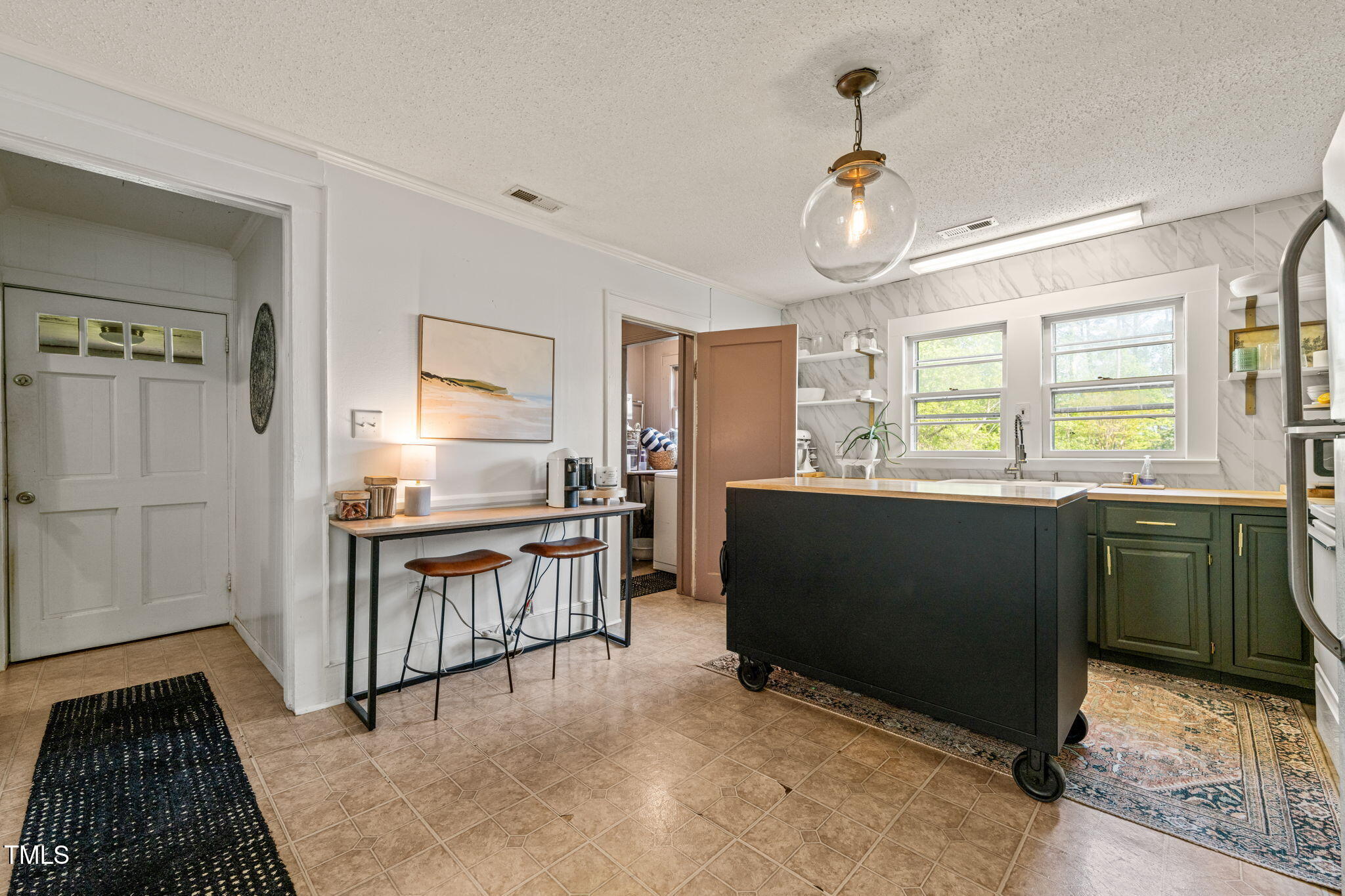12601 Boyce Mill Road Raleigh, NC 27613 - Photo 12 of 35 a kitchen with granite countertop a stove a sink and a refrigerator