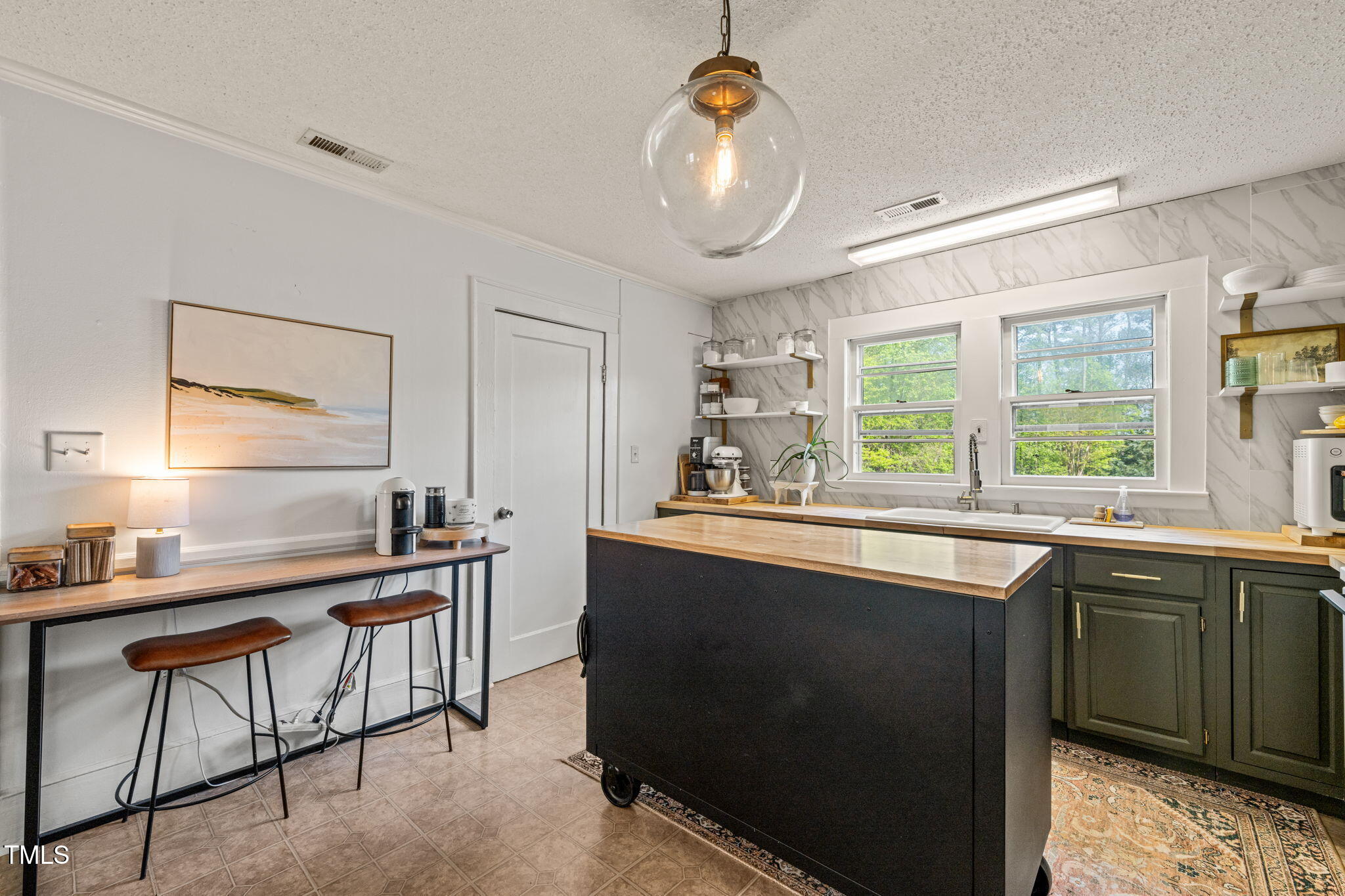 12601 Boyce Mill Road Raleigh, NC 27613 - Photo 15 of 35 a kitchen with stainless steel appliances granite countertop a sink a stove window and cabinets