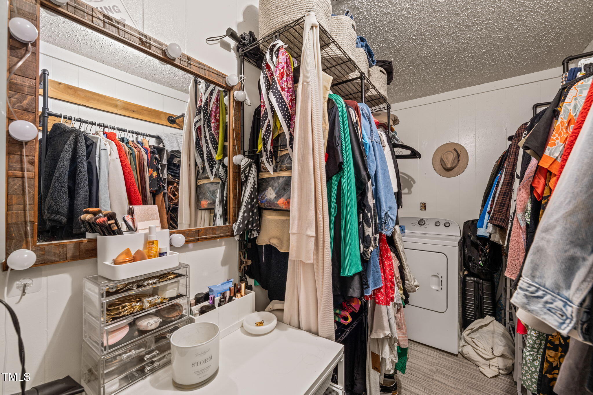 12601 Boyce Mill Road Raleigh, NC 27613 - Photo 18 of 35 a view of walk in closet with clothes