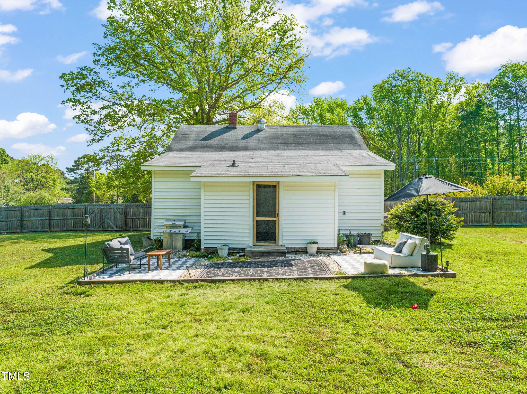 12601 Boyce Mill Road Raleigh, NC 27613 - Photo 21 of 35 a front view of house with yard and outdoor seating