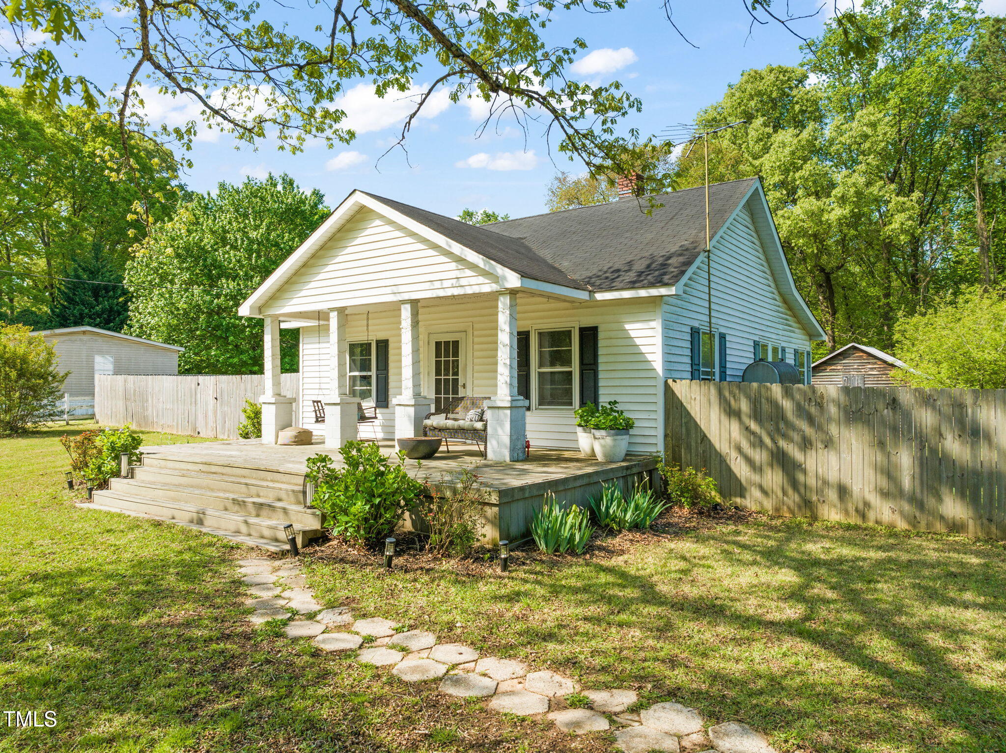 12601 Boyce Mill Road Raleigh, NC 27613 - Photo 28 of 35 a view of a house with backyard and sitting area
