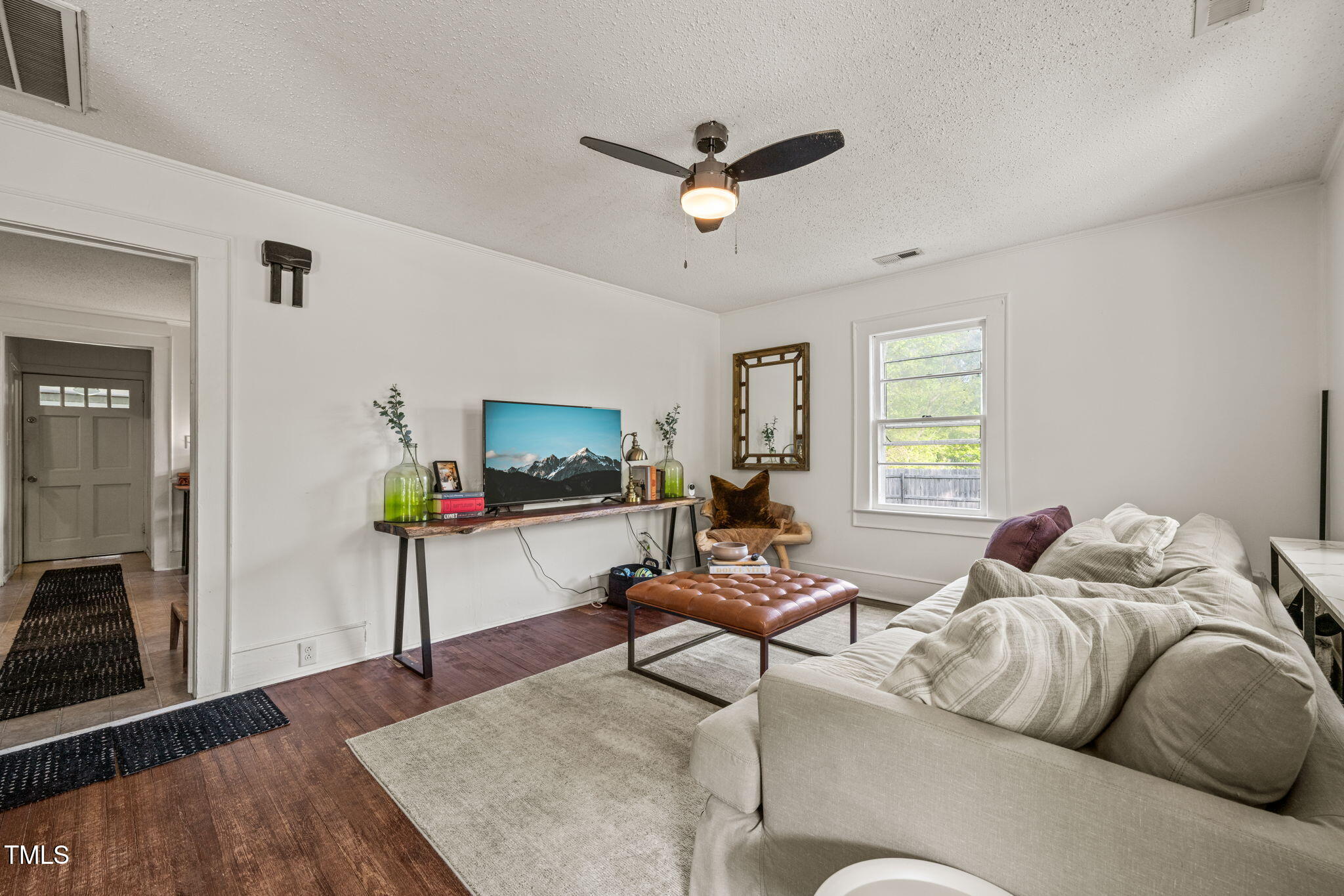 12601 Boyce Mill Road Raleigh, NC 27613 - Photo 3 of 35 a living room with furniture and a wooden floor
