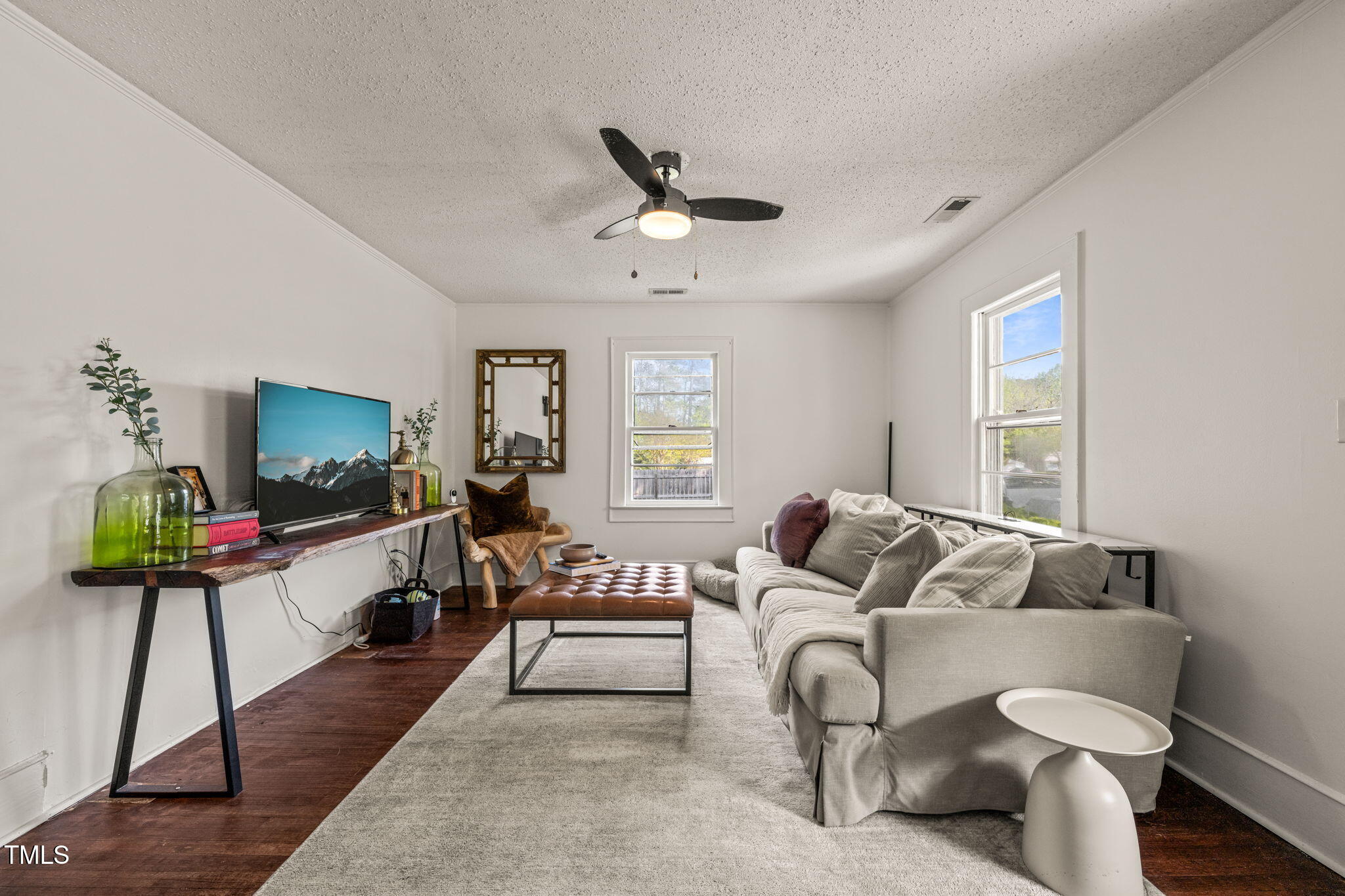 12601 Boyce Mill Road Raleigh, NC 27613 - Photo 4 of 35 a living room with furniture and a flat screen tv
