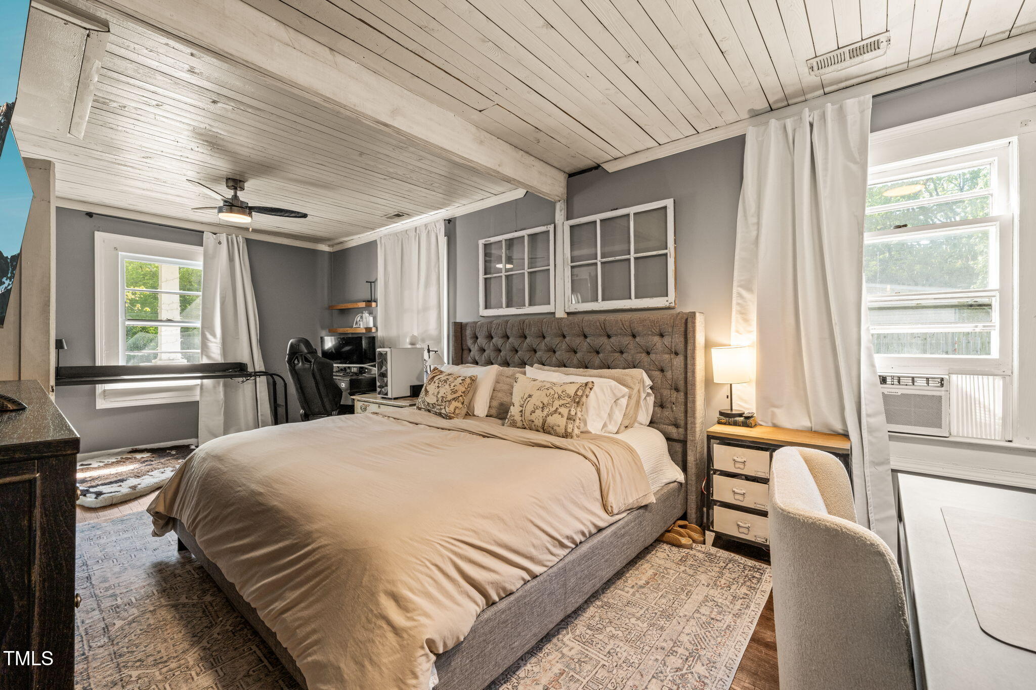 12601 Boyce Mill Road Raleigh, NC 27613 - Photo 8 of 35 a bedroom with a large bed and a large window