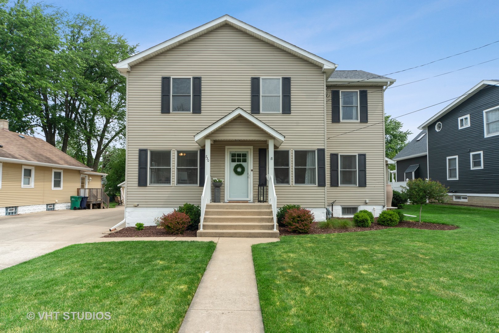 a front view of a house with a yard