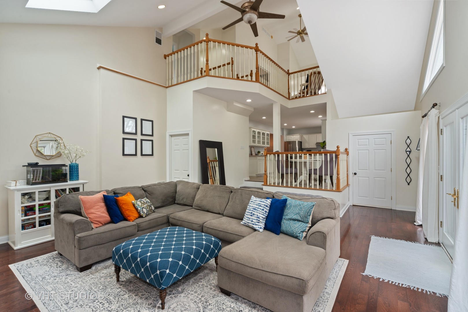 230 West Harrison Road Lombard, IL 60148 - Photo 12 of 31 a living room with furniture a rug and a chandelier