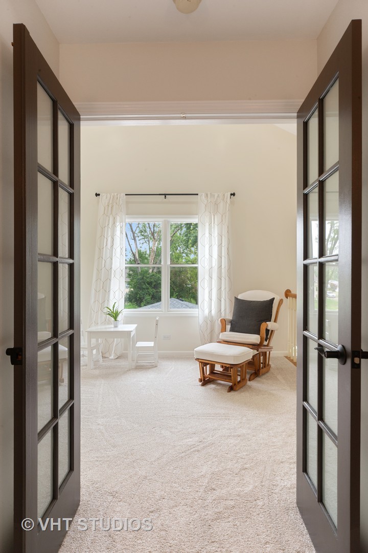 230 West Harrison Road Lombard, IL 60148 - Photo 13 of 31 a living room with furniture and a window