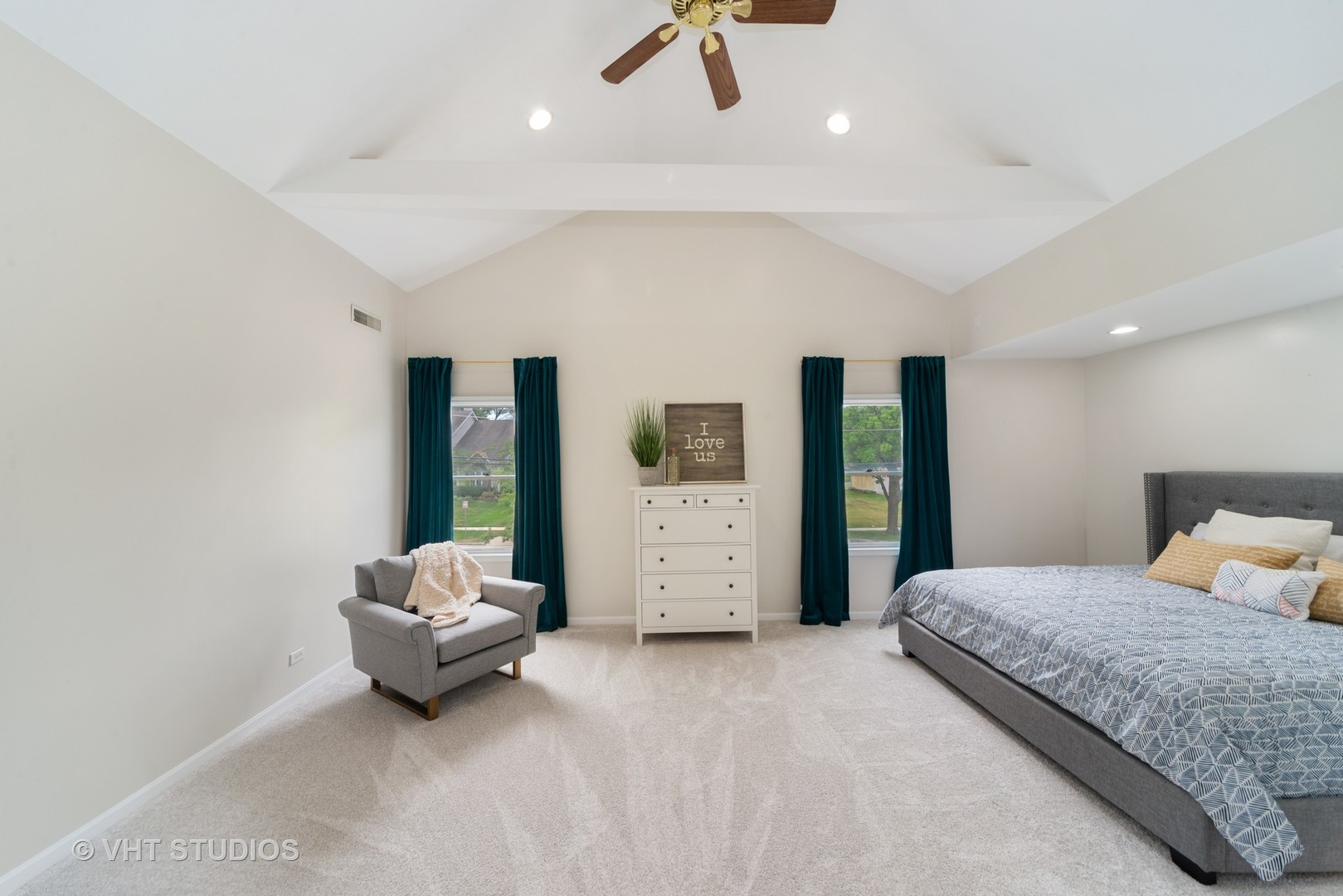230 West Harrison Road Lombard, IL 60148 - Photo 15 of 31 a spacious bedroom with a bed a couch and cabinet
