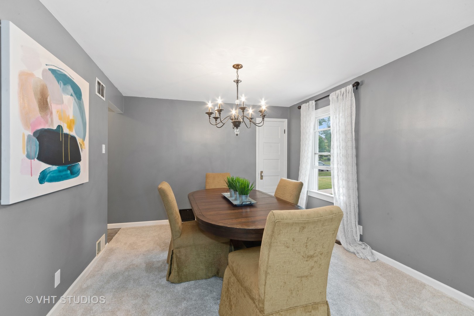 230 West Harrison Road Lombard, IL 60148 - Photo 4 of 31 a view of a dining room with furniture a chandelier and a window