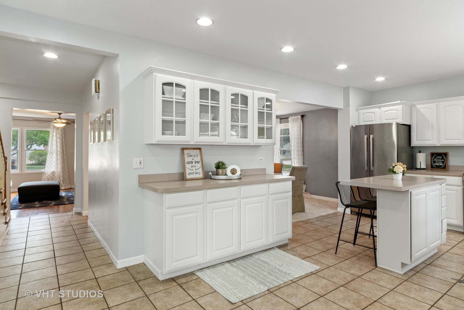 230 West Harrison Road Lombard, IL 60148 - Photo 8 of 31 a kitchen with stainless steel appliances granite countertop a refrigerator and a stove top oven