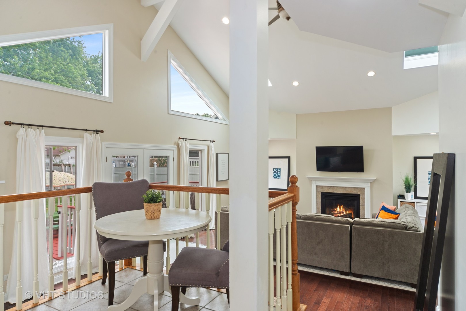 230 West Harrison Road Lombard, IL 60148 - Photo 9 of 31 a living room with furniture a flat screen tv and a fireplace