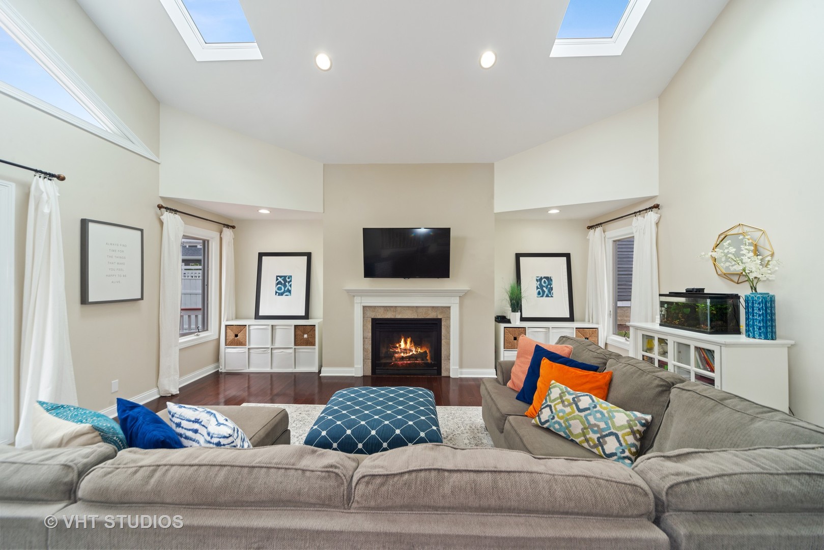 230 West Harrison Road Lombard, IL 60148 - Photo 10 of 31 a living room with furniture fireplace and flat screen tv