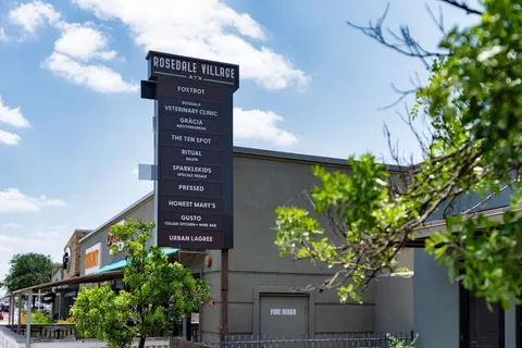 a view of a flower pot with wooden fence