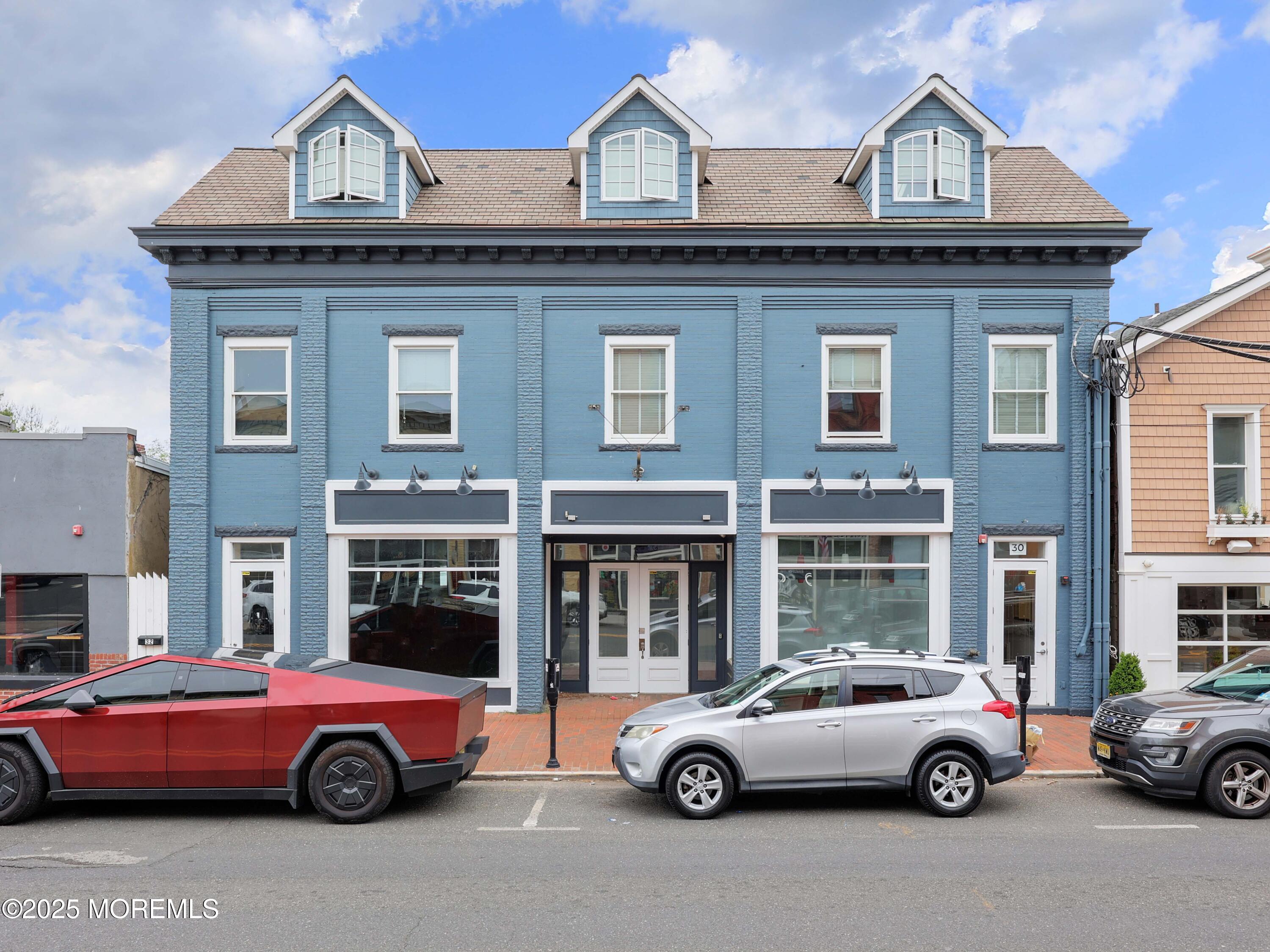 30 West Front Street, Unit E Red Bank, NJ 07701 - Photo 1 of 17 a car parked in front of a house