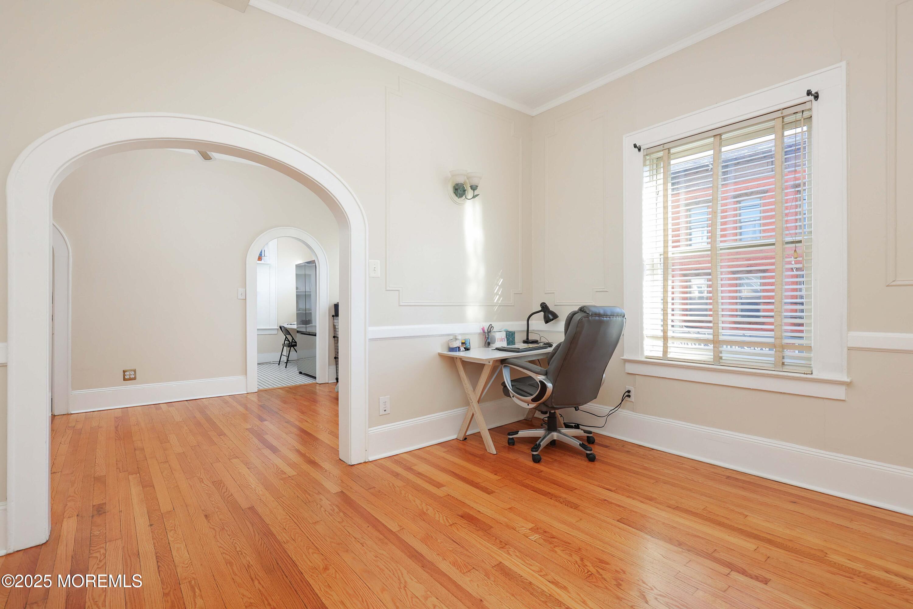 30 West Front Street, Unit E Red Bank, NJ 07701 - Photo 11 of 17 a view of a workspace with wooden floor and a window