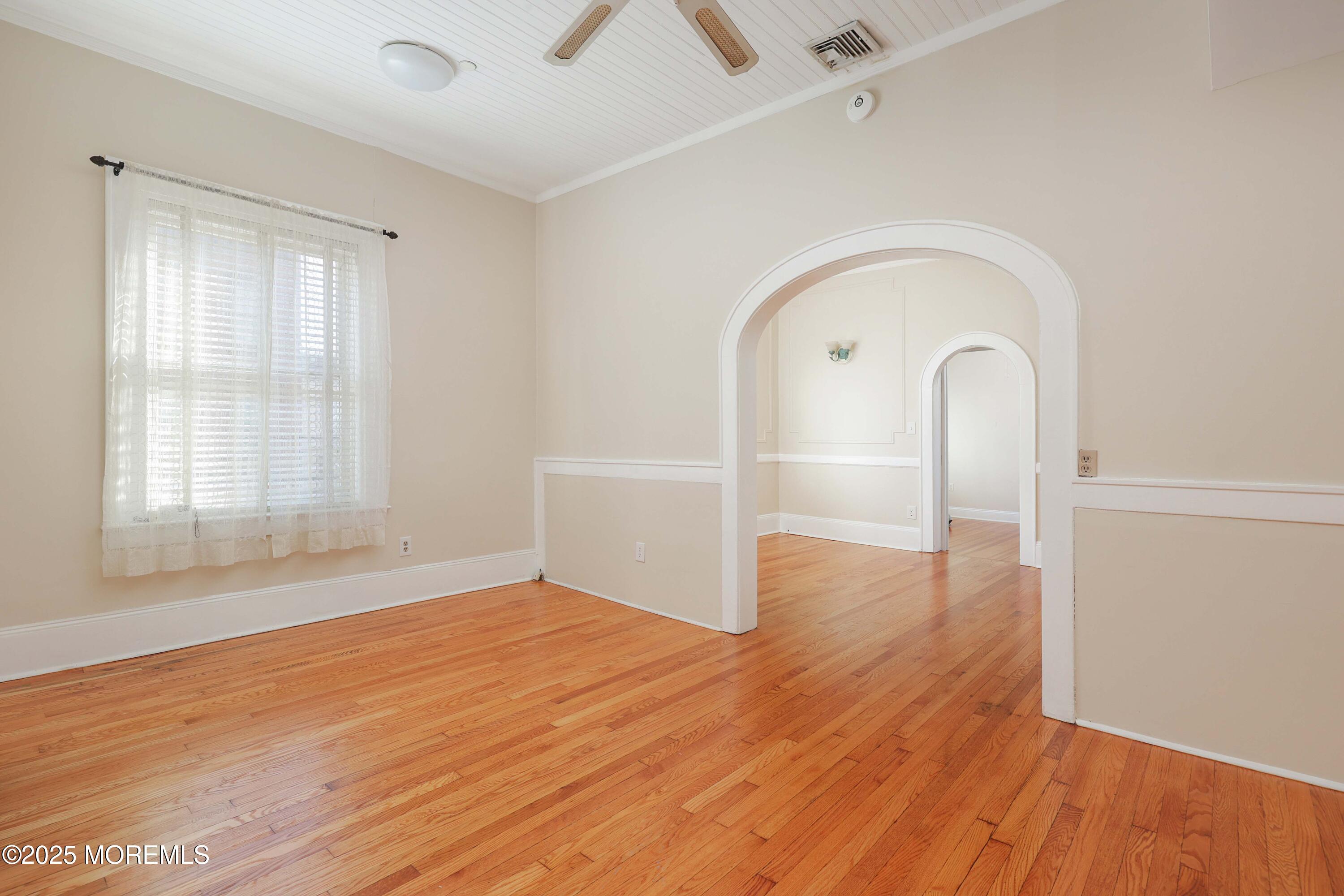 30 West Front Street, Unit E Red Bank, NJ 07701 - Photo 12 of 17 a view of empty room with wooden floor and fan