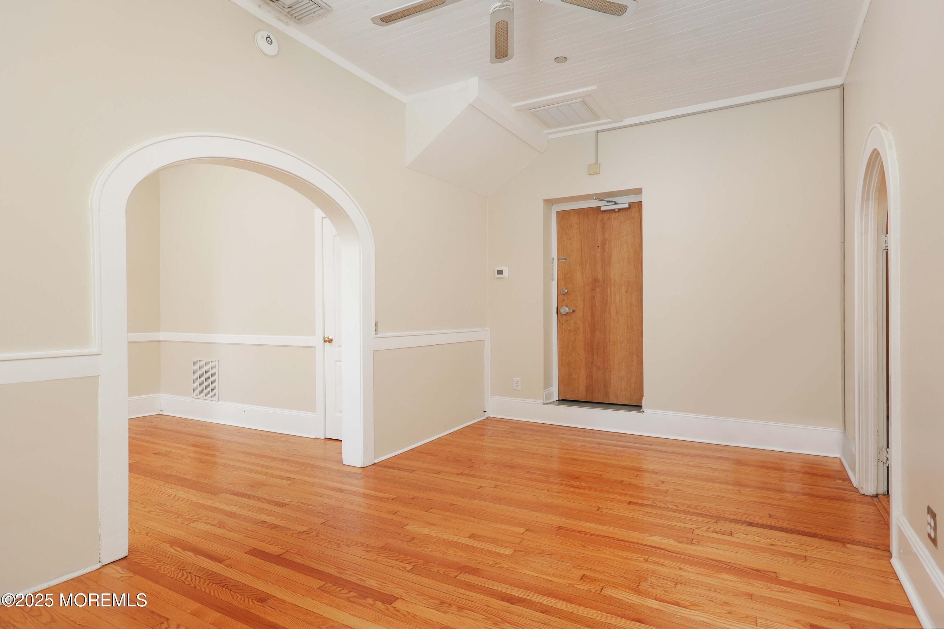 30 West Front Street, Unit E Red Bank, NJ 07701 - Photo 13 of 17 an empty room with wooden floor and closet