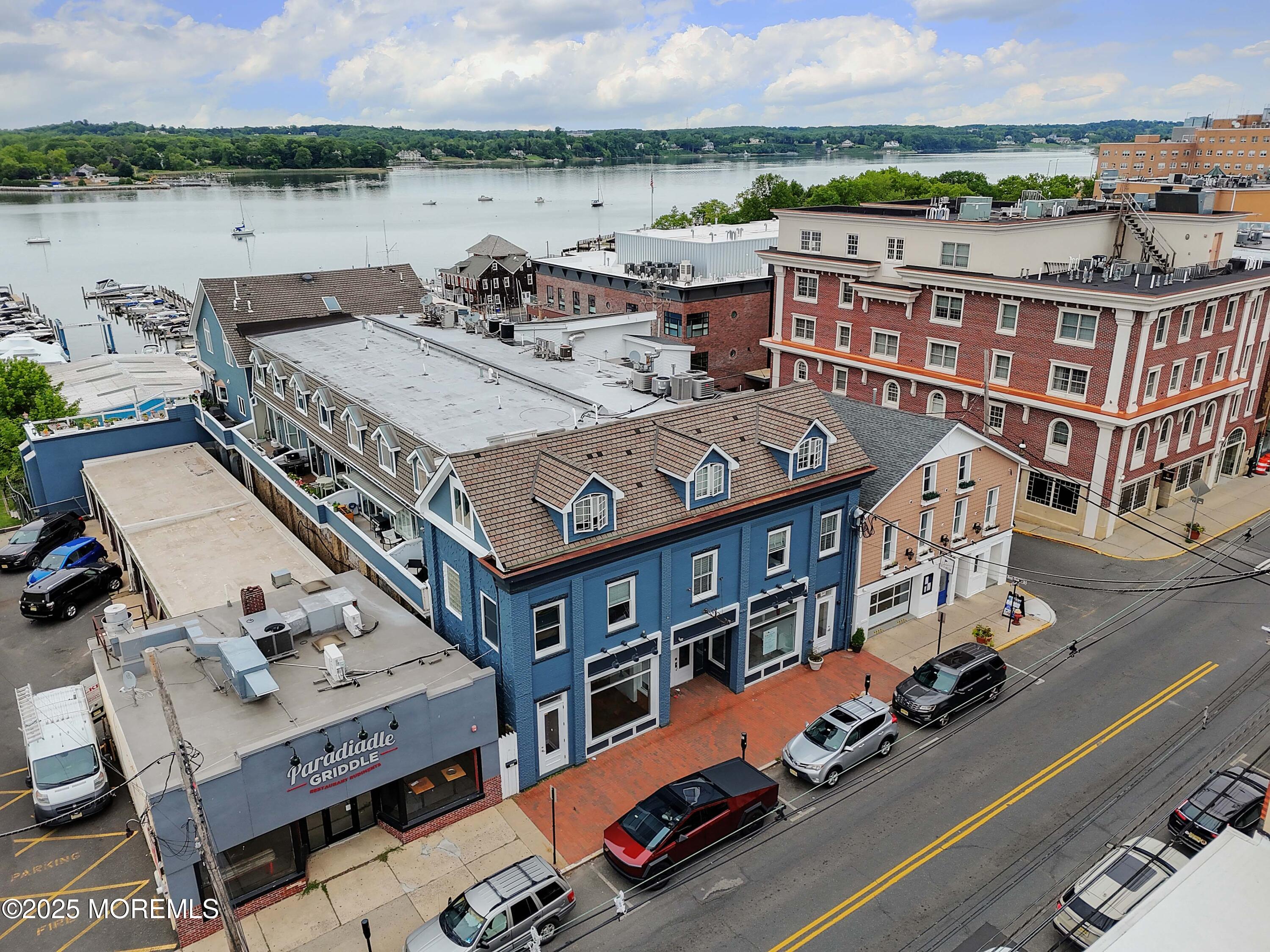30 West Front Street, Unit E Red Bank, NJ 07701 - Photo 3 of 17 an aerial view of a house with a lake view