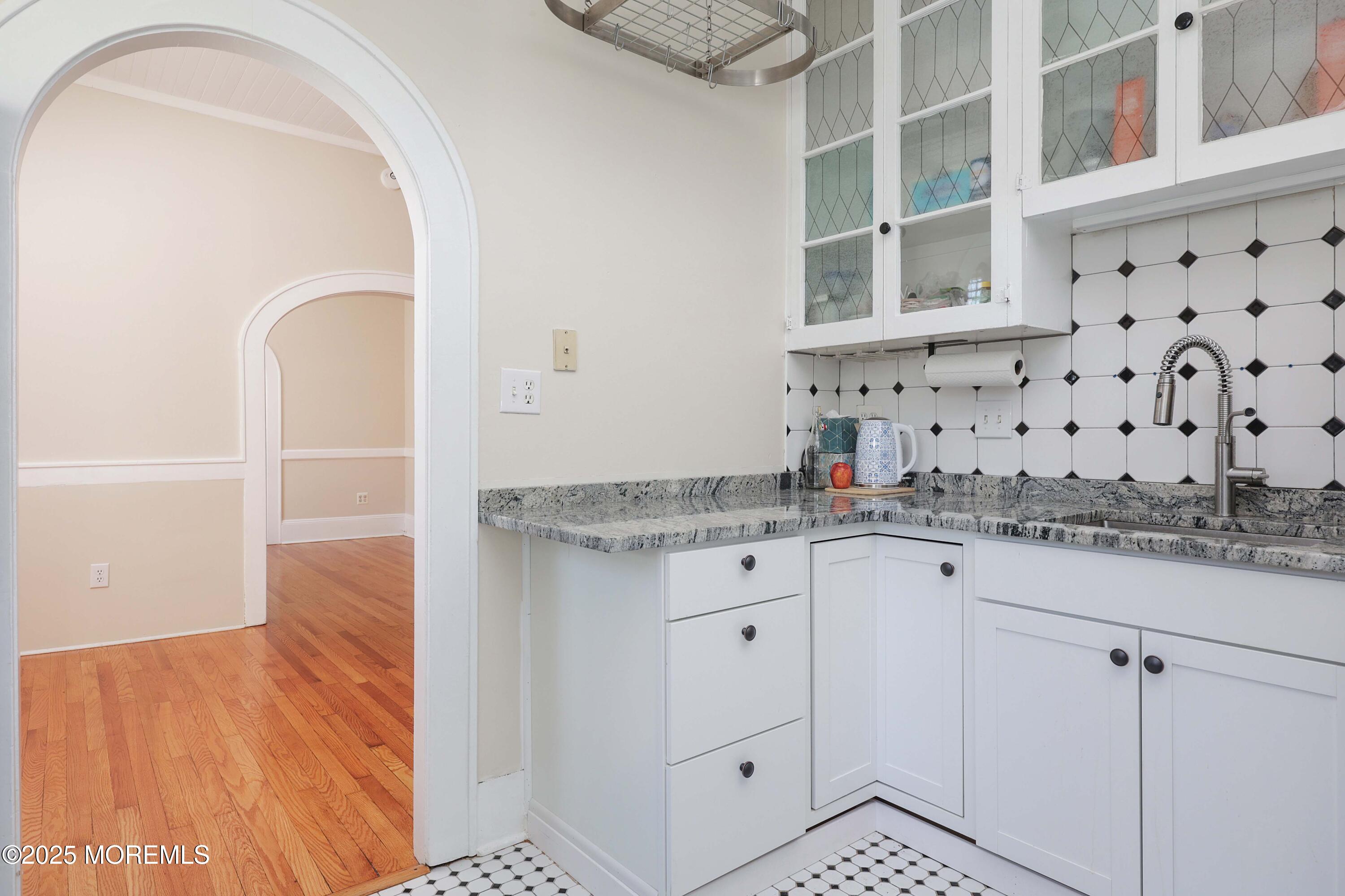 30 West Front Street, Unit E Red Bank, NJ 07701 - Photo 7 of 17 a bathroom with a sink and a mirror