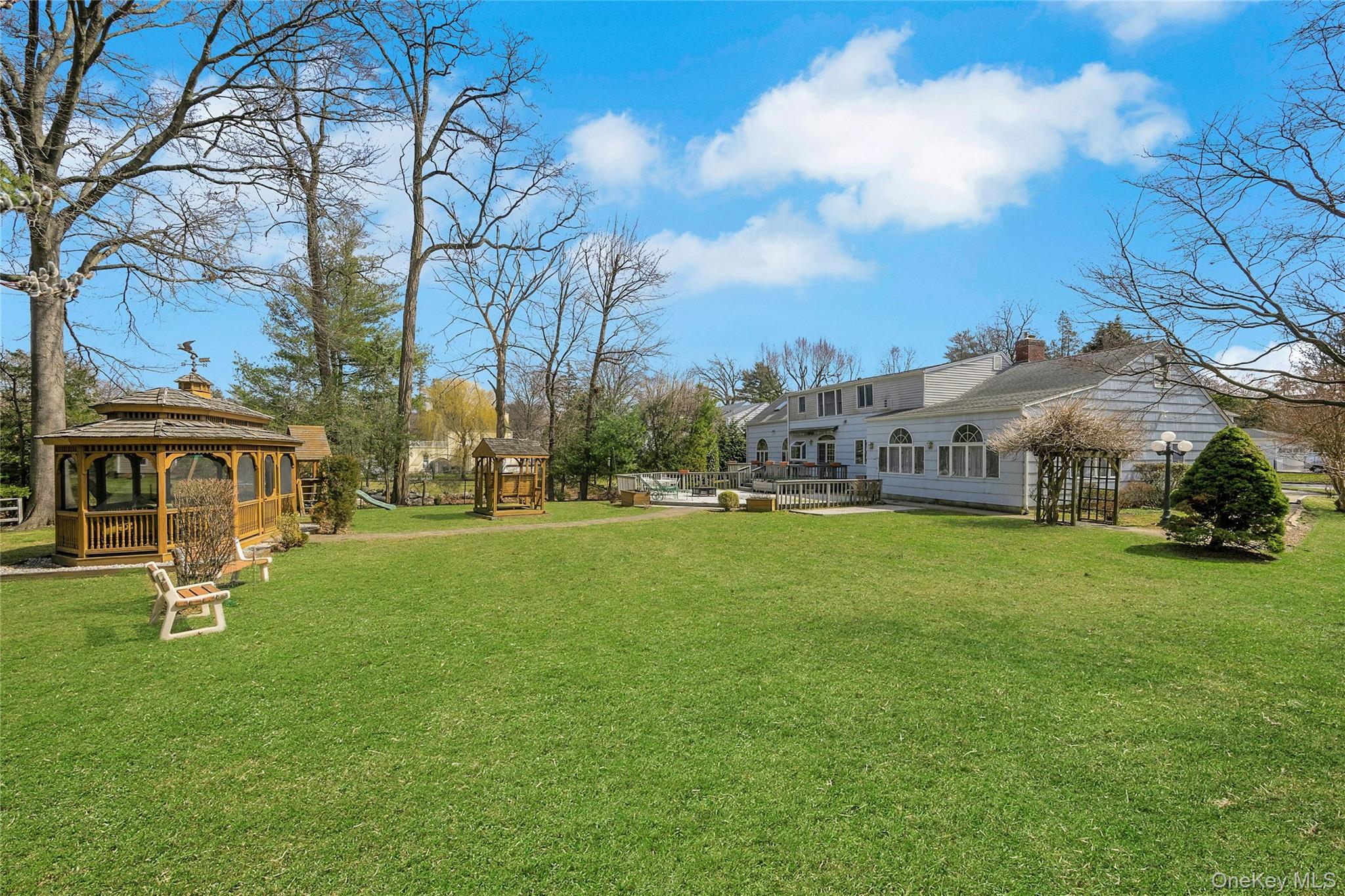 115 Elizabeth Road New Rochelle, NY 10804 - Photo 12 of 47 a view of a big yard with palm trees