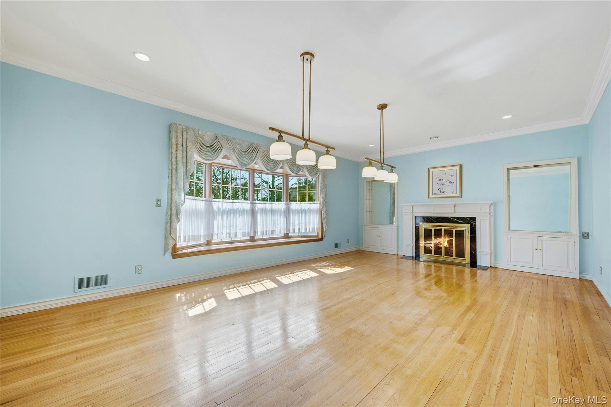 115 Elizabeth Road New Rochelle, NY 10804 - Photo 15 of 47 a view of empty room with wooden floor and fan
