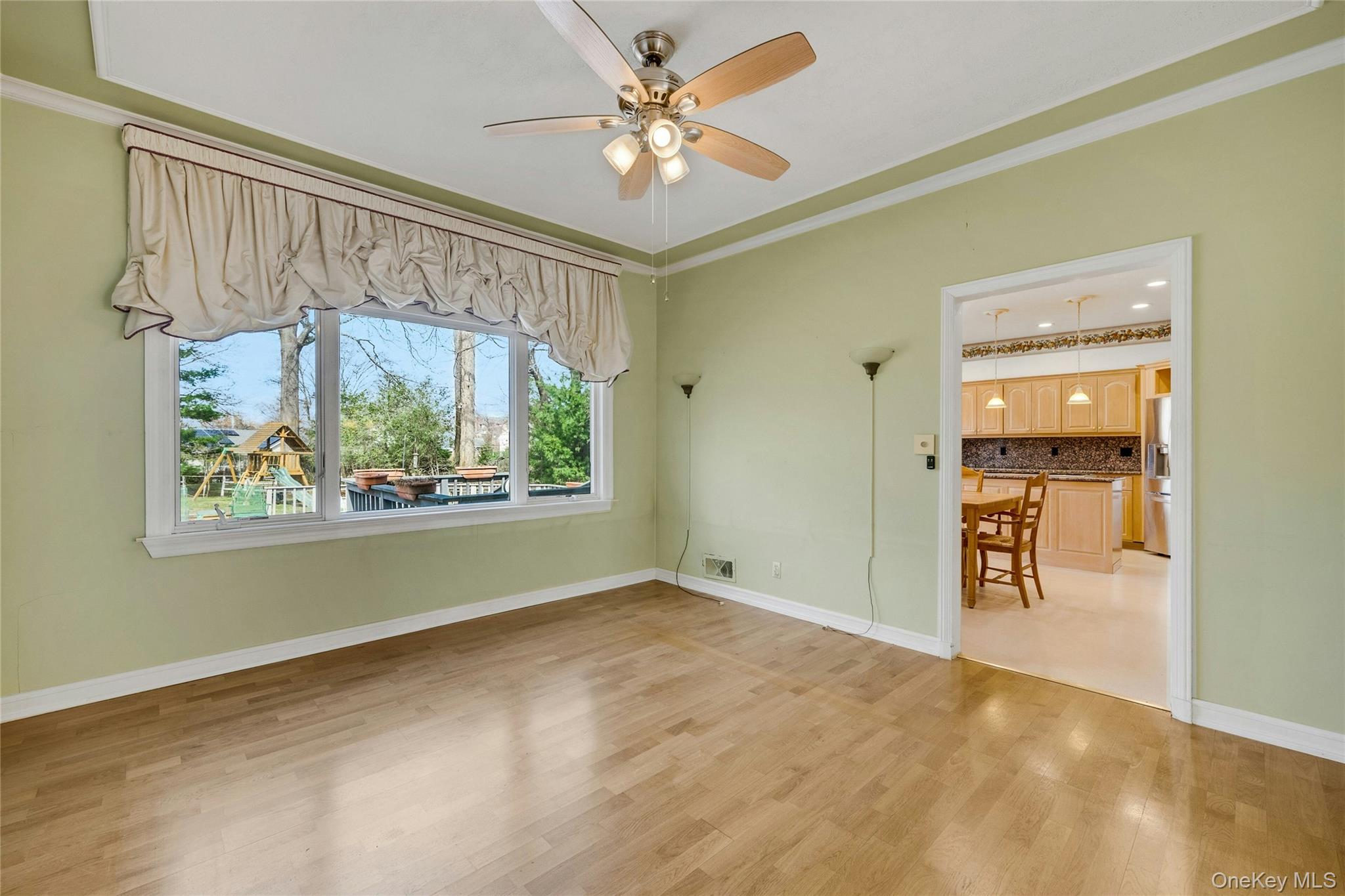 115 Elizabeth Road New Rochelle, NY 10804 - Photo 18 of 47 an empty room with windows and a ceiling fan