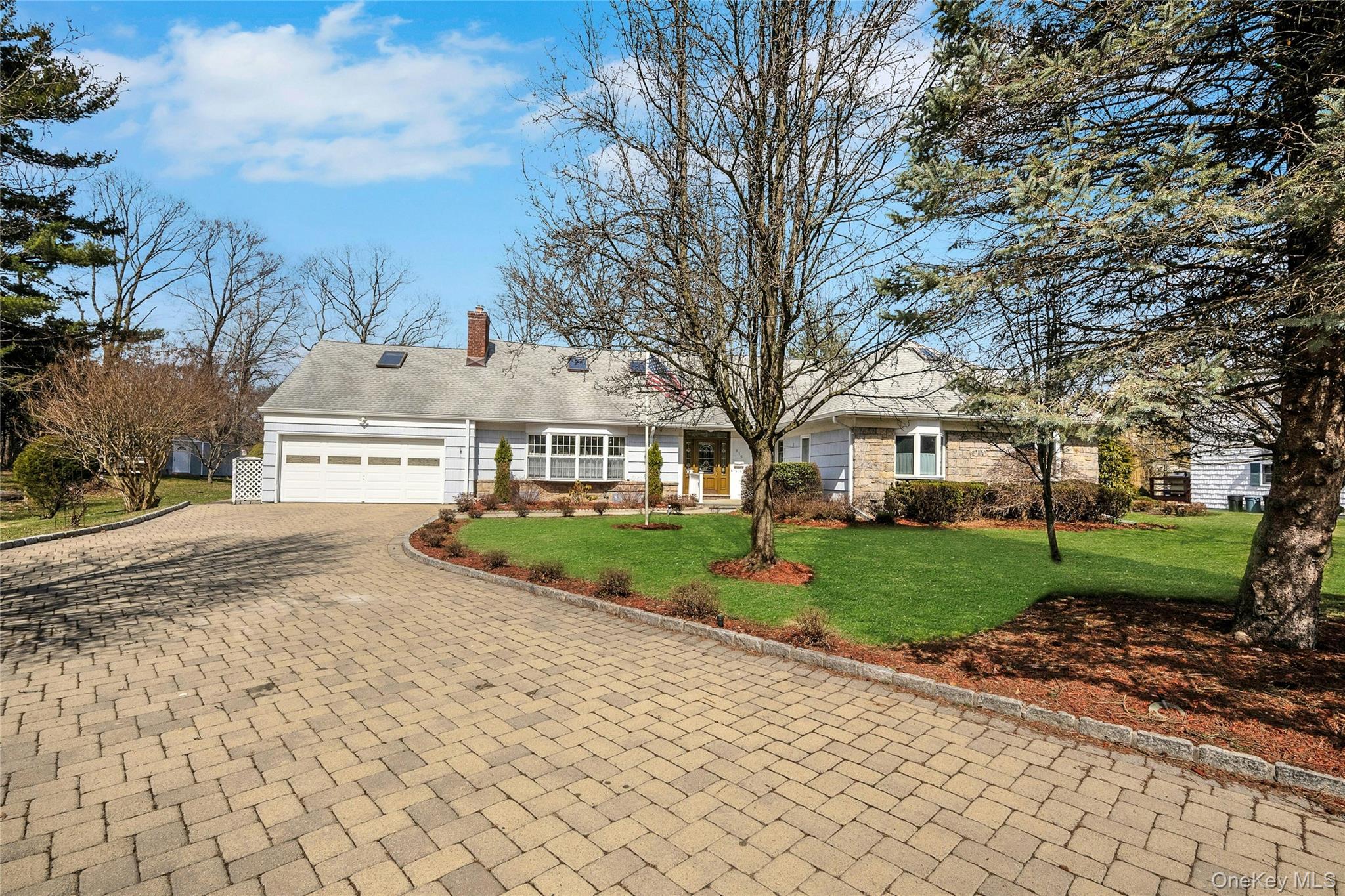 115 Elizabeth Road New Rochelle, NY 10804 - Photo 2 of 47 a view of a large house with a big yard and large trees